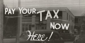 Pay your tax sign on window